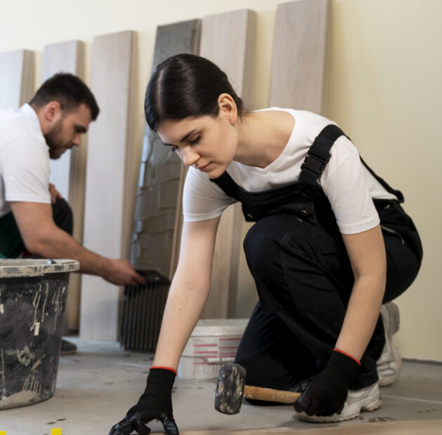 workers-tiling-floor-indoors